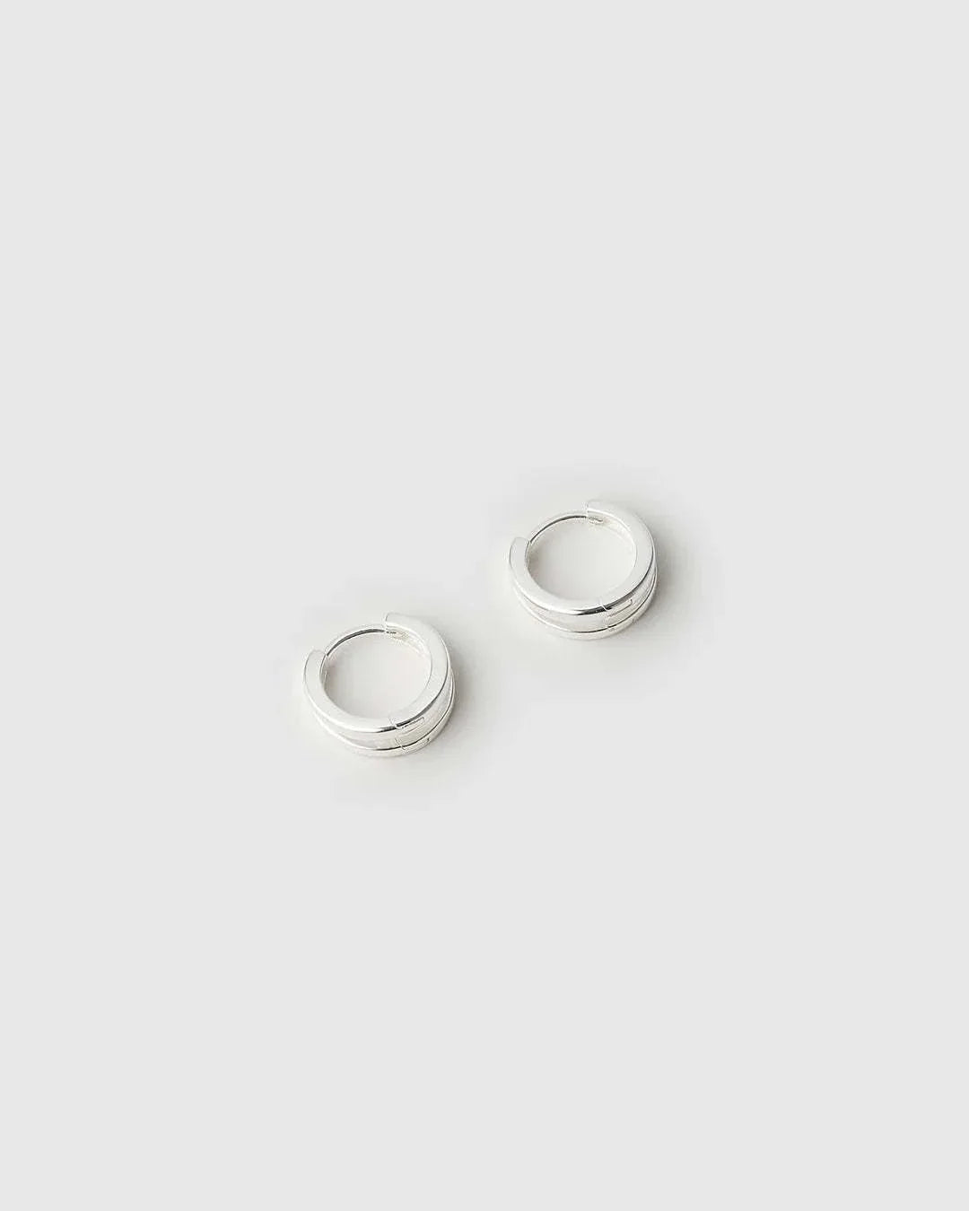 Arms of Eve Jean Silver Huggie Earrings