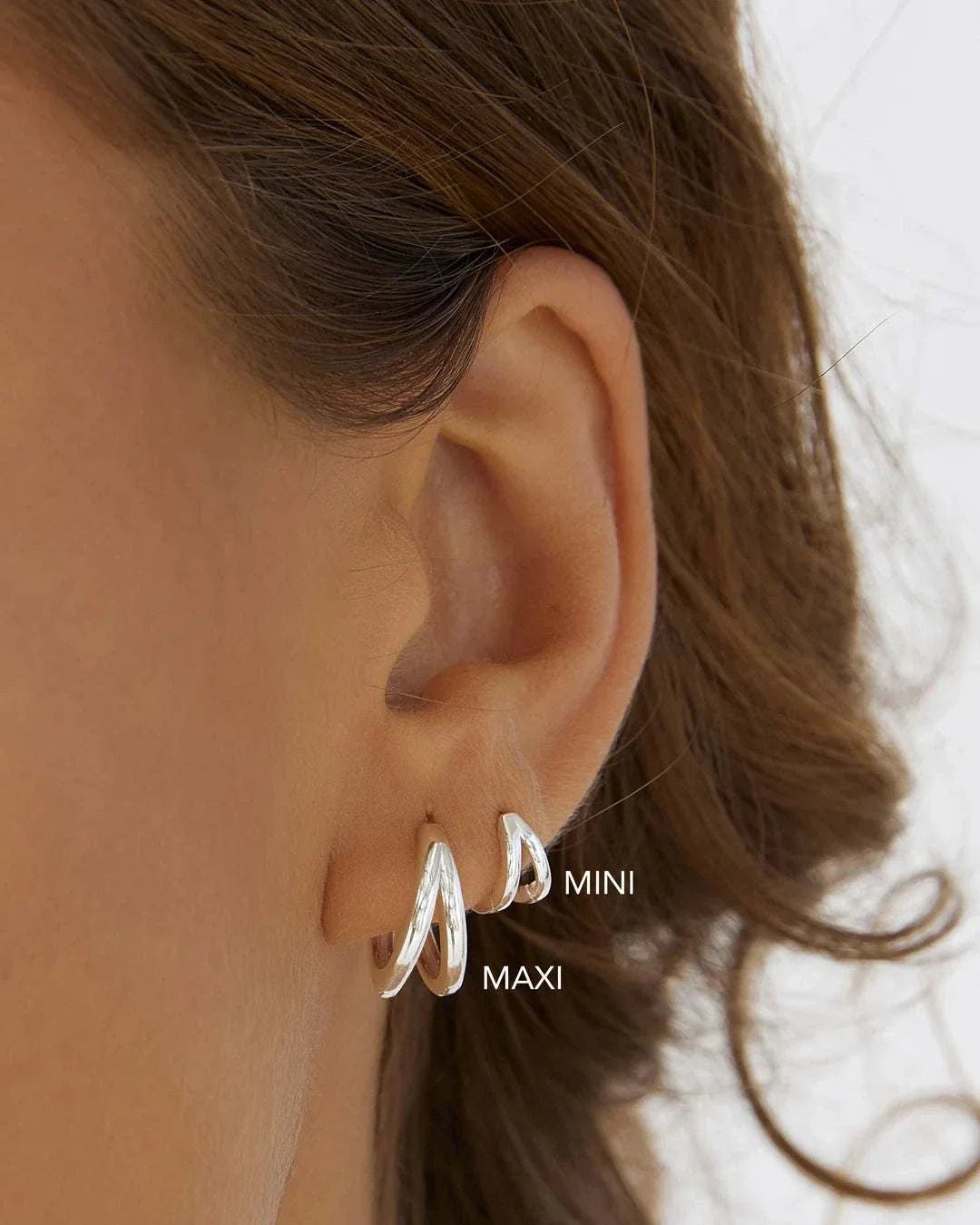Arms of Eve Jean Silver Huggie Earrings
