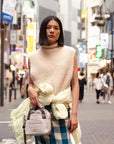 Indi and Cold Chaleco Turtle Neck Crudo