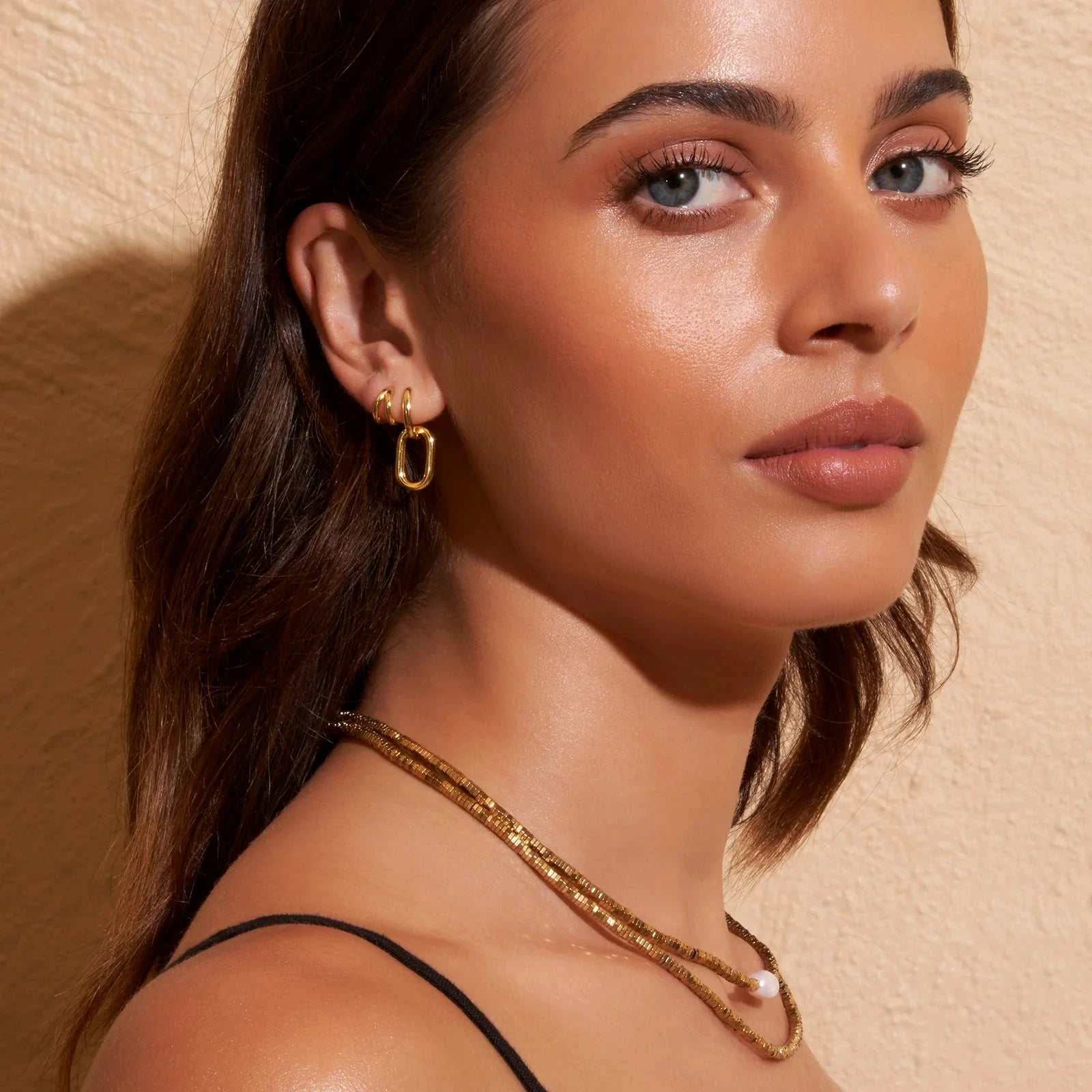 Arms of Eve Jean Huggie Earrings Gold