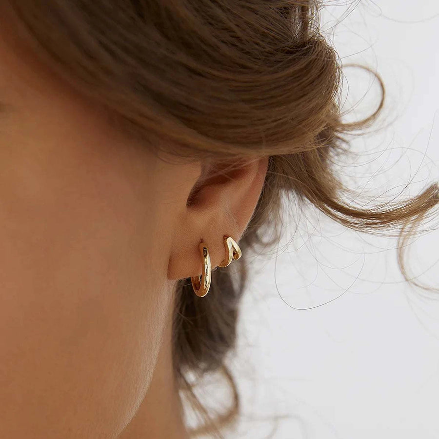 Arms of Eve Jean Huggie Earrings Gold